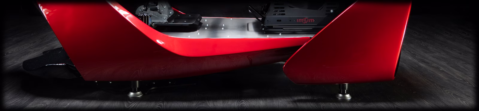 The lower body of a GARRA seen from the side, with a D-BOX actuator under each end.