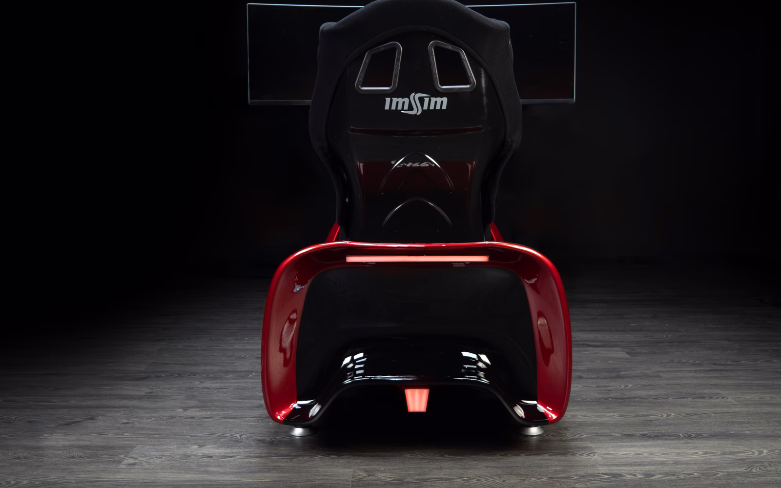 From behind, where the seat and the light bar close the shape.