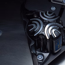 A tactile transducer bolted under the chassis of a GARRA.