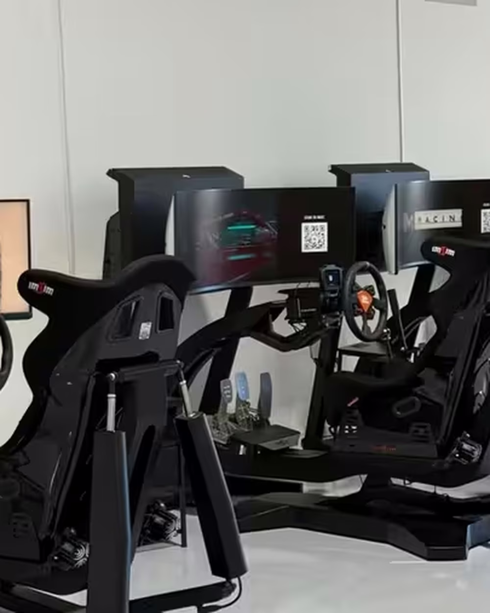 Motion simulators on the floor at SIM1 Racing.